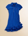 A signature polo design is transformed into a sporty, casual dress with the addition of a double-tiered ruffle hem.Ribbed polo collarShort sleeves with ribbed armbandsButton downSide ruching with bow detailDouble-tiered ruffle hemCottonMachine washImported Please note: Number of buttons/snaps may vary depending on size ordered. 