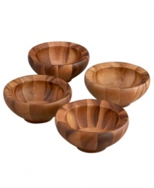 Rustic, yet refined, this set of Yaro salad bowls takes shape in warm shades of dense acacia hardwood. Set on a narrow pedestal with a round profile that opens wide, the individual bowls offer a naturally beautiful way to enjoy fresh greens. Designed by Sean O'Hara.