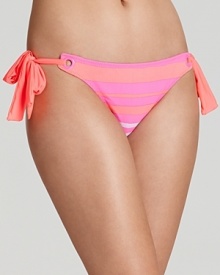 Show your stripes with this sunrise colored bikini from Nanette Lepore. Its tropical colorway and cute cut are sure to cause a stir in the surf, so wear it to make waves.