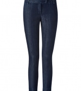 Dark blue stretch cotton denim - Vertical streaked wash - Low rise - Cropped above ankle - Chino-style tab waist detail and back pockets - Feminine cut with simple, masculine styling - Pair with cashmere pullovers, button downs and ballerina flats