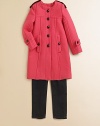 Elegant and tailored, this stunning knit coat with ottoman ribbing refreshes a classic look.Round stitched necklineShoulder epauletsLong sleeves with button tabsSeamed front bodiceButton placketAngled front button pocketsBack yoke flapBack half beltBack center inverted pleat56% cotton/34% wool/9% nylon/1% elastaneDry cleanMade in ItalyPlease note: Number of buttons may vary depending on size ordered. 