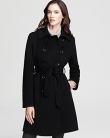 This belted DKNY trench coat gets an update from elegant seaming detail for a modern look to meet the new season.