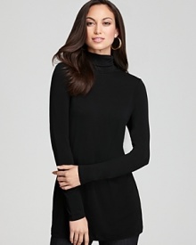 Rendered in sumptuous silk, this Eileen Fisher turtleneck lends luxe appeal to your laidback style with a classic silhouette in a chic shade.