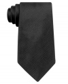 An accessory that will see your guy through all kinds of special occasions: Solid, ribbed-silk necktie from Nautica.