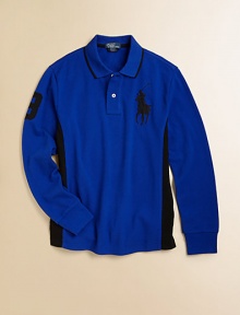 A long-sleeved cotton mesh polo, crafted in a classic fit, is detailed with an embroidered Big Pony, contrast stripes at the side and a twill 3 for an athletic look.Ribbed polo collarLong sleeves with ribbed cuffsButton-frontUneven vented hemCottonMachine washImported