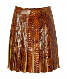 The ultimate showstopper! This ultra-luxe python and suede pleated skirt from Salvatore Ferragamo begs to be shown off in style - Fitted waist, allover pleating, concealed side zip closure, made with supple suede and glossy python - Flared silhouette - Wear with a cashmere turtleneck, a neutral-hued cape, and classic pumps