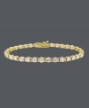 Take your style up a notch with a hint of sparkle. B. Brilliant's luminous tennis bracelet features a row of round-cut cubic zirconias (8-1/4 ct. t.w.) set in 18k gold over sterling silver. Approximate length: 7-1/4 inches.