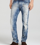 Bleaching and distressing lend effortless edge to these slim-fit, straight leg jeans from Diesel.