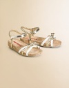 Leather sandal with braided bow detail and adjustable strap.Adjustable ankle strapLeather upperRubber soleImported