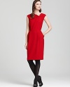 An asymmetric neckline and slant pockets infuse modern elegance into this Lafayette 148 New York sheath dress.