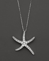 Gracefully undulating starfish pendant necklace with pave diamond clusters.