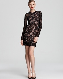 Nicole Miller goes forward with an asymmetric silhouette, showing off a two-sided look in sheer mesh and intricate lace.