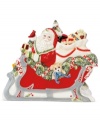 Make way for the sleigh! This holiday napkin holder from Fitz and Floyd adds instant cheer to ordinary essentials, sandwiching a stack of napkins or your favorite Christmas cards between Santa and winter scenery.