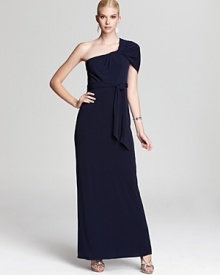 Show off a shoulder in this sleek Trina Turk gown, boasting a sophisticated look with a belted waist for a flattering fit.