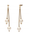 Prepare yourself for an evening of elegance. These romantic double drop earrings by Monet feature ivory-colored glass pearls set in gold tone mixed metal. Approximate drop: 2-1/4 inches.