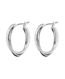 Star-worthy hoops with a hint of shimmer. Monet earrings feature a twisted hoop design in silver tone mixed metal. Approximate diameter: 7/8 inch.