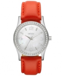 A casual, shimmering creation from DKNY for those days when a burst of color is absolutely necessary. Watch crafted of red leather strap and oval stainless steel case. Bezel embellished with 48 clear crystal accents. White dial features silver tone three hands, applied stick indices, numerals at three, six, nine and twelve o'clock, minute track and logo at twelve o'clock. Quartz movement. Water resistant to 50 meters. Two-year warranty.