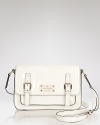 kate spade new york gives the classic crossbody satchel a hit of gloss. Boasting an classic, scholarly shape, this bag is school-girl chic with a pleated skirts and glasses.