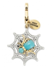 Weave a web of fierce fashion with this spider web charm from Juicy Couture. With glass accents, logo tag and colorful epoxy. Finished with a lobster clasp. Crafted in gold tone mixed metal. Approximate drop: 2 inches.