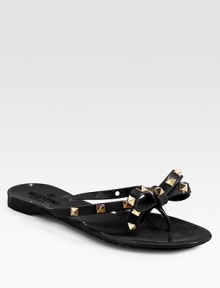 Low-cut silhouette sprinkled in edgy studs, topped with a signature bow. Studded PVC upperPVC lining and solePadded insoleMade in ItalyOUR FIT MODEL RECOMMENDS ordering one half size down as this style runs large. 