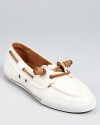 Hunter goes nautical with the Val boat shoe, constructed in canvas with luxe leather details.