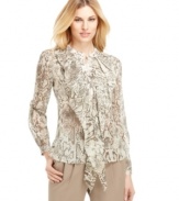 Make a statement in this chic blouse from Jones New York, featuring on-trend animal print and a feminine ruffle at the front.