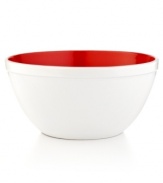 Pop goes the color. A bright red interior pokes its head out of this clean & crisp enamel bowl, adding the perfect punch of lively color to your countertop. Heading straight from prep to presentation, this durable bowl lets you stir, mix and make, all in one place.