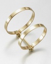 Two bold bangles, joined together, have an industrial screw-in design that enhances their simple drama.BrassDiameter, about 2.75Width, about 1.75Imported