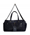 Stash away your weekend essentials in chic preppy style in Marc by Marc Jacobs navy nylon duffle bag - Tonal faux-leather trim, double top handles, removable adjustable nylon shoulder strap, front and back patch pockets with hidden magnetic snap closures, luggage tag clipped to front, embossed logo on front, top zip, inside strap with push-stud closures, 2 front wall slot pockets, zippered back wall pocket, gold-toned logo hardware - The perfect size for toting around travel essentials, or daily trips to the gym