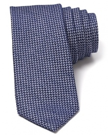 Knot this tonal tie for a dapper look that suits the summer and can be worn all year round, too.