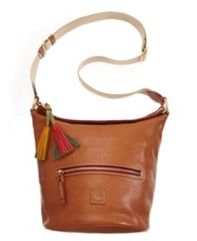 This western-chic style by Dooney & Bourke features a feed bag silhouette with colorful tassel pulls at top zip closure. Goldtone hardware and an iconic emblem at front provide the perfect amount of polish.