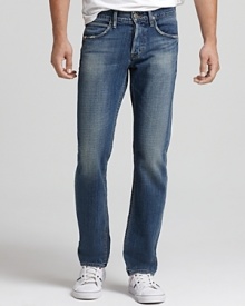 The Hudson jeans feature relaxed straight legs, a traditional button fly and vivid orange topstitching.