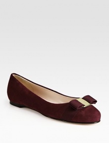 Vivacious suede staple with leather lining, fronted by an elegant grosgrain ribbon bow. Suede and grosgrain ribbon upperLeather lining and solePadded insoleMade in ItalyOUR FIT MODEL RECOMMENDS ordering true size. 