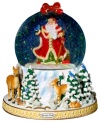 Santa Claus at his most natural. A beautiful winter scene plays out below as Santa is showered with a flurry of shimmering glitter in this elaborate snow globe by Christopher Radko.