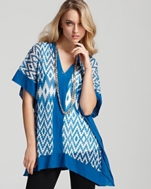 Tranquil blue zigzags keep the look of this Sweet Pea tunic current, creating a fresh pairing with the season's sleekest skinnies and a long shining necklace.