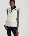 This Theory vest refines the season's must-have layer with a luxurious fur-lined hood and modern, streamlined silhouette.