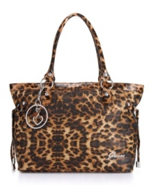 Drama! Leopard print covers every trendy inch of the Tryst carryall from GUESS, and the tail-like tassels add kinetic movement.