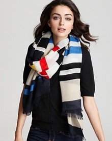 Add a splash of color to a dull winter day with this bold striped scarf from kate spade.