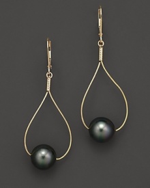 Sleek gold teardrops pierce black Tahitian pearls.