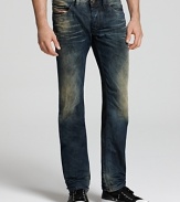 Diesel's Safado jean cuts a clean profile with a slim fit, straight leg and contrast weathering with colored rinse accent.