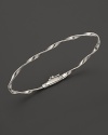 A gleaming twist of sterling silver, elegant alone or beautiful stacked. From the Marco Bicego Marrakech collection.