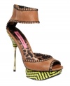 Daring, sexy, and colorful, too. Betsey Johnson's Tricksy platform sandals feature a shiny metallic stiletto heel, black stitching around the edges, and a funky, printed platform.