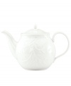 An elegant white-on-white pattern, embossed vine motif and interior glaze adorn this teapot from Lenox dinnerware. The dishes from the Opal Innocence Carved collection get your table set for refined dining every day. Qualifies for Rebate