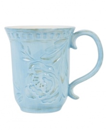 Sculpted blooms and a classic silhouette make the Toulouse mug by Fitz and Floyd a charming part of any casual landscape. A rustic sky-blue glaze adds to its antique appeal.