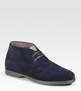 An ankle-high profile with two-eyelet construction in rich suede. Leather lining Padded insole Rubber sole Made in Italy 