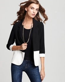 Marrying fashion's most versatile hues, this black and ivory color block Aqua blazer is one of the season's smartest pieces. Take it from day to night, uptown to downtown and marvel at its versatility.