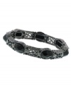 Victorian-inspired elegance with a dark and glamorous twist. Intricate setting features oval-shaped, faceted jet and crystal accents. Bracelet by 2028 crafted in mixed metal. Stretches to fit wrist. Approximate diameter: 2-1/2 inches.