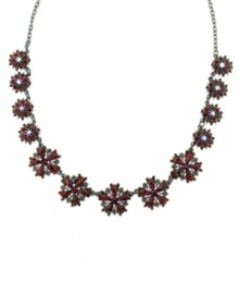 An eye-catching effect. Ravishing red glass accents are festooned into a floral theme on this striking necklace from 2028. Set in hematite tone mixed metal. Approximate length: 16 inches + 3-inch extender.