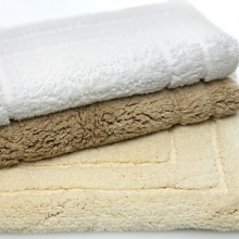 The Caress Bath Rugs from Habidecor are ultra soft underfoot with a cotton/silk blend.