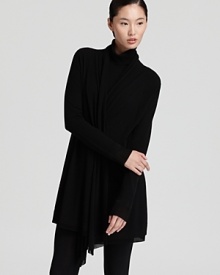 A signature Donna Karan New York cozy is the ultimate layering piece, cut in an open silhouette with a elegant draped collar that effortlessly frames silky camis and stretch tees.